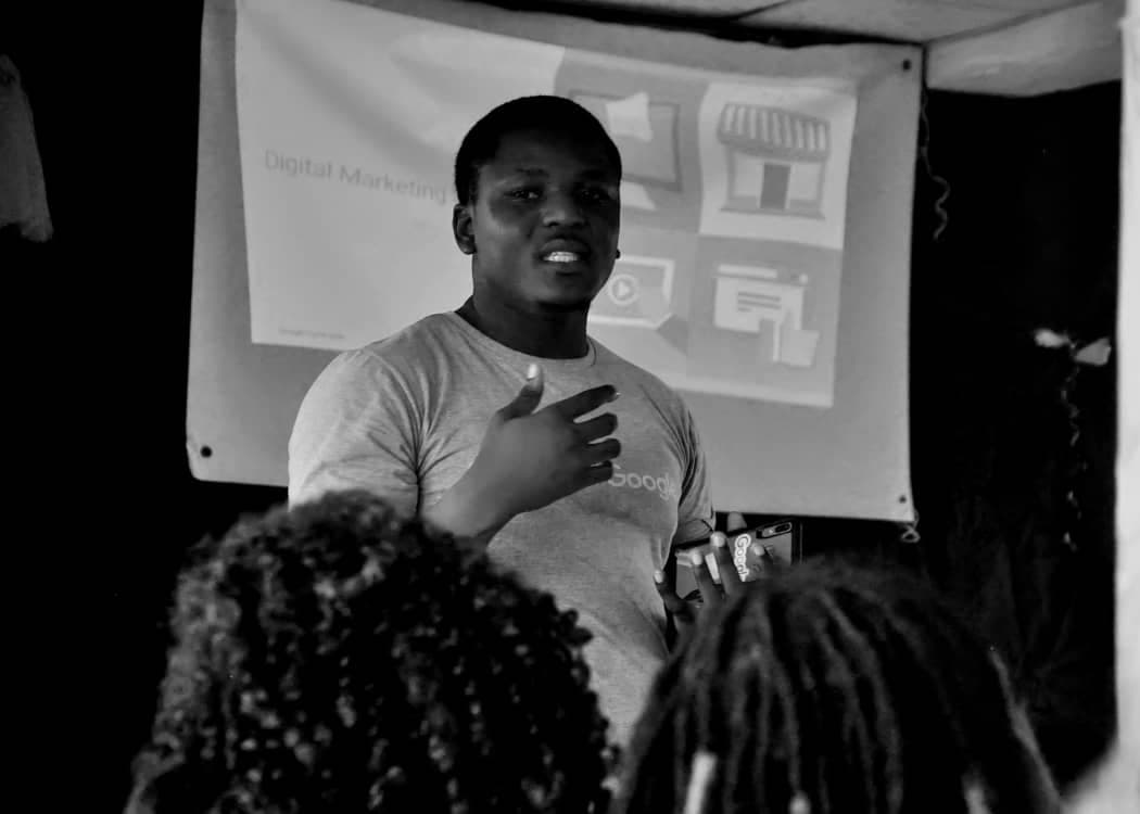 Black and white: Adebayo Chike presenting a digital marketing session