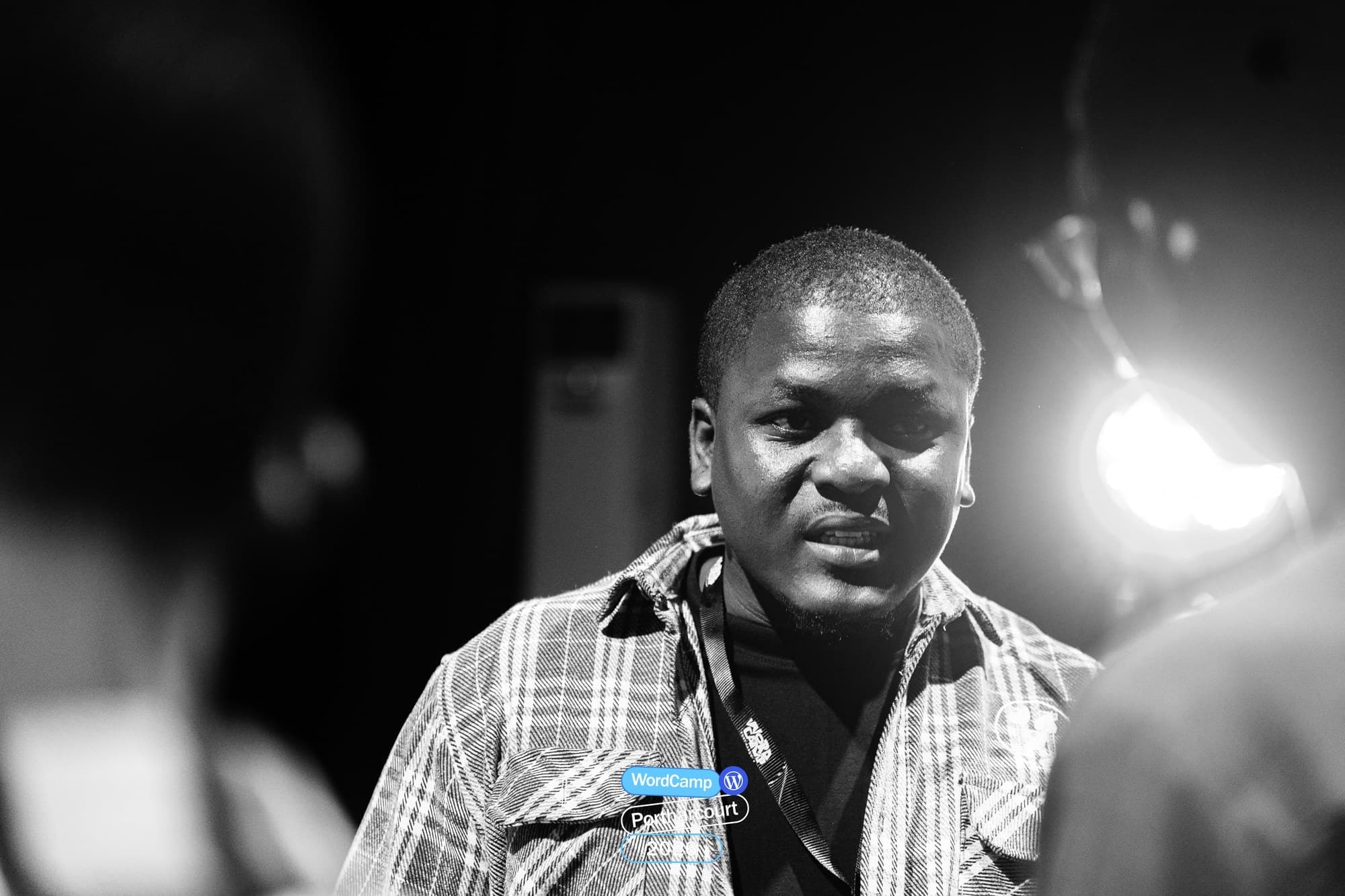 Black and white close-up of Adebayo Chike speaking